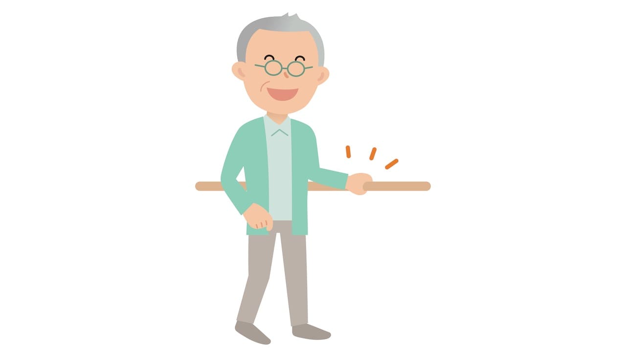 手すりを使って歩く人のイメージ